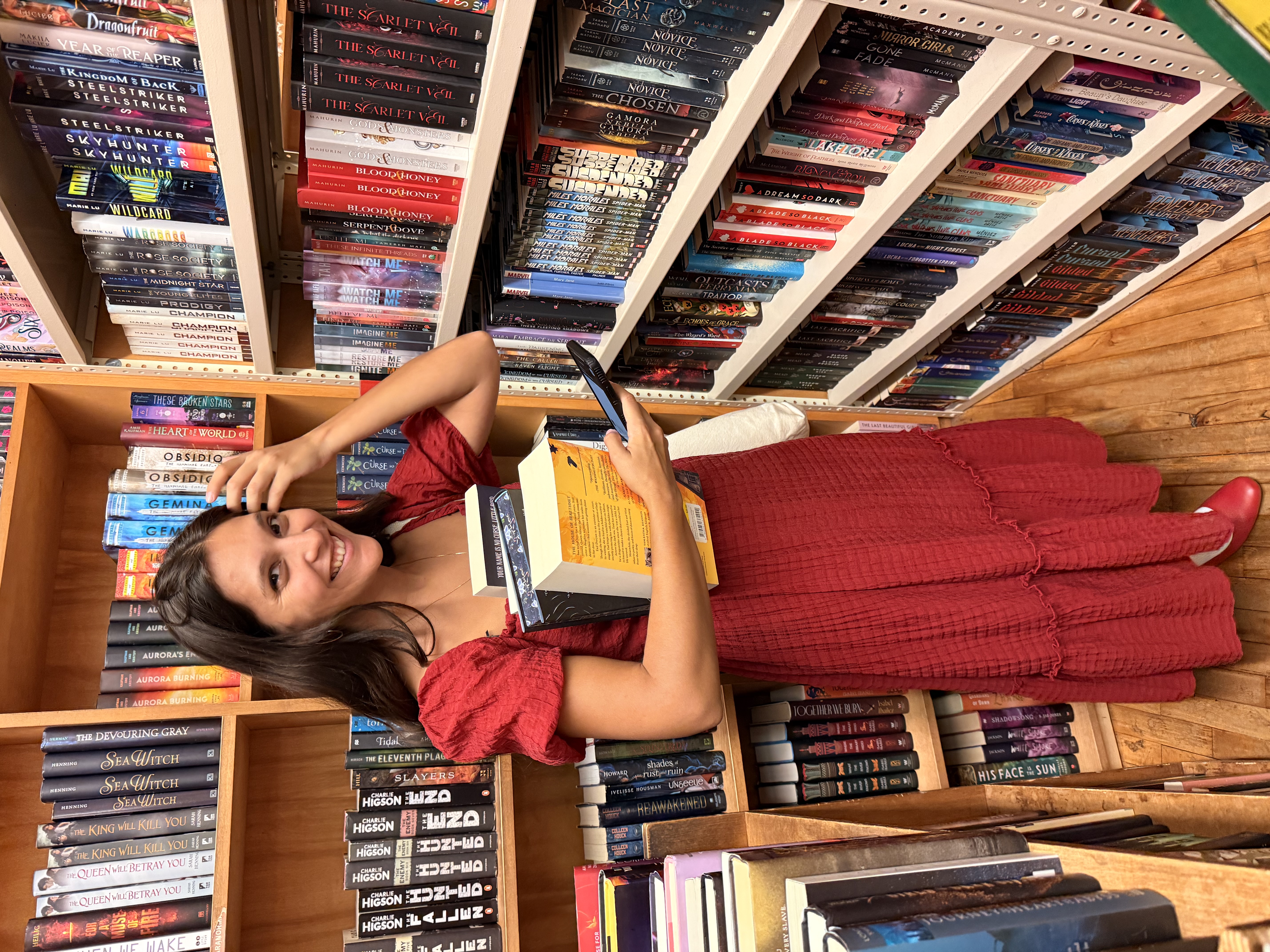 Mina Panacy surrounded by books